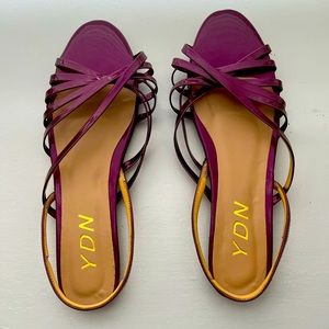 Metallic purple slingback-style flat sandals
